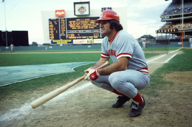 American baseball player Pete Rose, of the Cincinatti Reds, crouches on the field before a game at Shea Stadium in Flushing Meadows-Corona Park, Queens, New York, New York, July 24, 1978. The game, against the New York Mets, resulted in Rose increasing his hitting streak to 37 consecutive games (the streak eventually lasted 44 games).