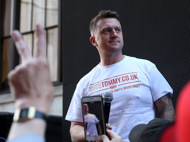 Founder and former leader of the anti-Islam English Defence League (EDL), Stephen Yaxley-Lennon, AKA Tommy Robinson, addresses supporters outside the Old Bailey, London's Central Criminal Court, in central London on May 14, 2019, following a hearing about his contempt of court charges. (Photo by ISABEL INFANTES / AFP) (Photo credit should read ISABEL INFANTES/AFP via Getty Images)