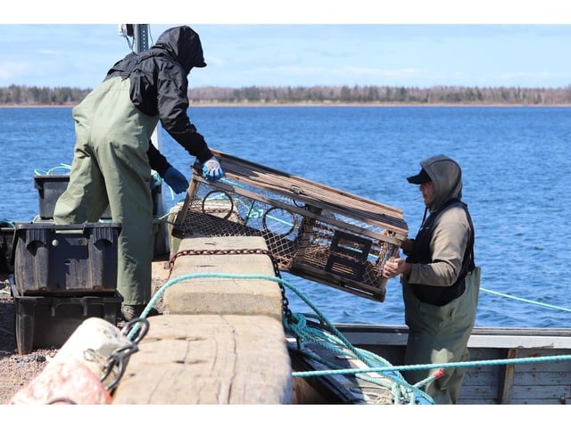 Fishers from Lennox Island load traps before taking to the water on May 7, 2022 for the first day of the community's moderate livelihood fishery. Lennox Island Chief Darlene Bernard says DFO officials seized several lobster traps on or around May 18, 2025, which she called an escalation.