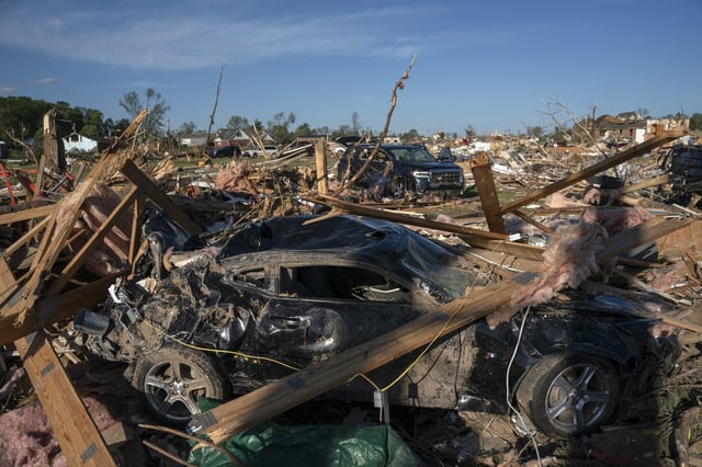 Debris is seen on a damaged car after a tornado hit in London, Kentucky on May 17, 2025. Severe storms ravaged Missouri, Kentucky, and Virginia.