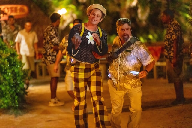 Pleakley (Billy Magnussen, left) and Jumba (Zach Galifianakis) go undercover as humans to find an alien fugitive in "Lilo & Stitch."