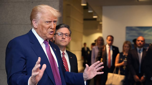 With Speaker of the House Mike Johnson (R-LA) by his side President Donald Trump speaks to the press following a House Republican meeting at the U.S. Capitol on May 20, 2025 in Washington, DC.