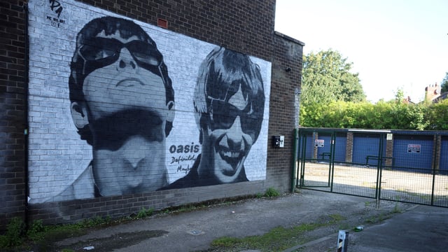 A view of a mural of Oasis band members Liam and Noel Gallagher by artist Pic.One.Art on the side of Sifters record shop in the Burnage area of Manchester, Britain, August 31, 2024. REUTERS/Phil Noble/File Photo