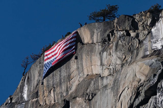 An upside down American flag was hung from El Capitan in Yosemite National Park on Feb. 22, 2025, in protest of job cuts to federal public lands workers.