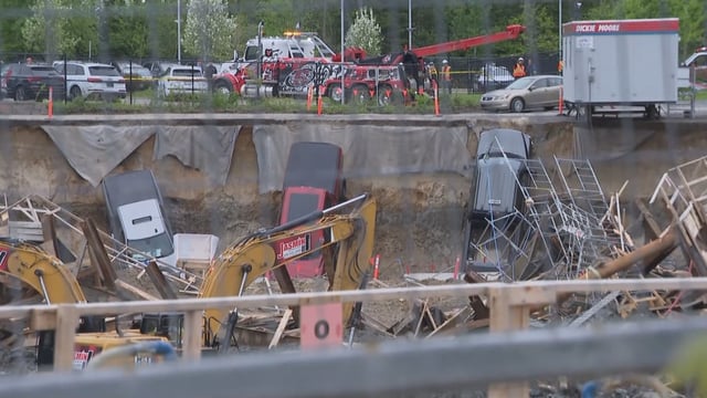 Multiple vehicles fell into a construction pit in Blainville, Que., after one of its retaining walls collapsed. 