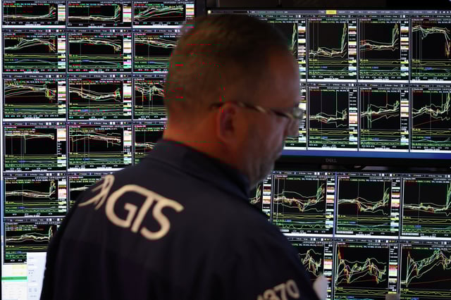 A trader works on the trading floor at The New York Stock Exchange (NYSE) in New York City, U.S., September 18, 2024. REUTERS/Andrew Kelly/File Photo