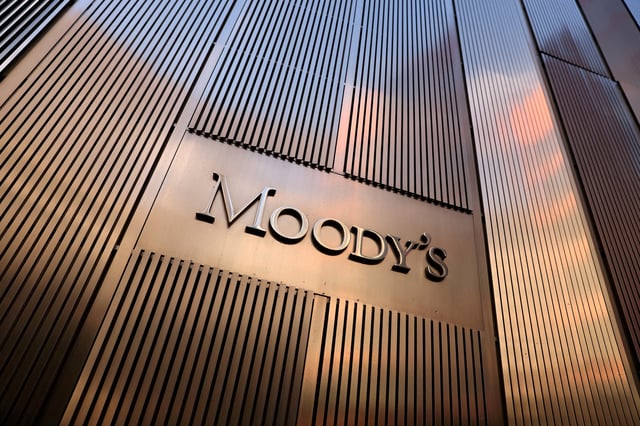 Signage is seen outside the Moody's Corporation headquarters in Manhattan, New York, U.S., November 12, 2021. REUTERS/Andrew Kelly/File Photo