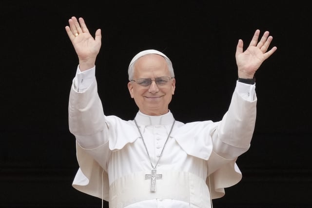 FILE - Pope Leo XIV appears at the central balcony of St. Peter's Basilica for his first Sunday blessing after his election, in St. Peter's Square at the Vatican, May 11, 2025.(AP Photo/Gregorio Borgia, File)