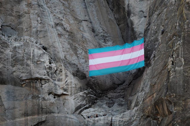 A group of trans, queer and ally climbers unfurled a massive transgender Pride flag on the face of Yosemite National Park's iconic El Capitan rock﻿ formation. 
