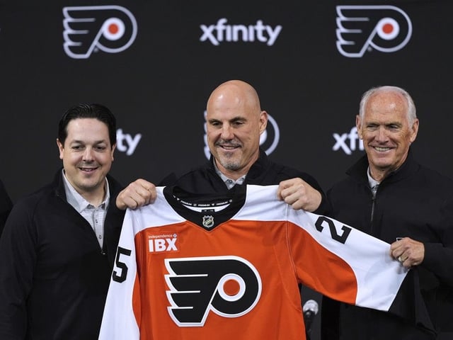 Philadelphia Flyers general manager Daniel Briere (left) and governor Dan Hilferty (right) pose after an introductory news conference for head coach Rick Tocchet on Friday in Philadelphia.