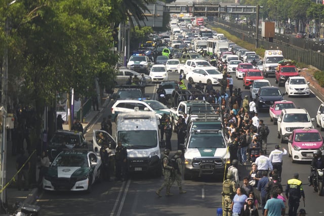 Police cordon off the area where Mexico City Mayor Clara Brugada&#39;s private secretary, Ximena Guzman, and adviser, Jose Munoz, were killed in Mexico City, Tuesday, May 20, 2025.