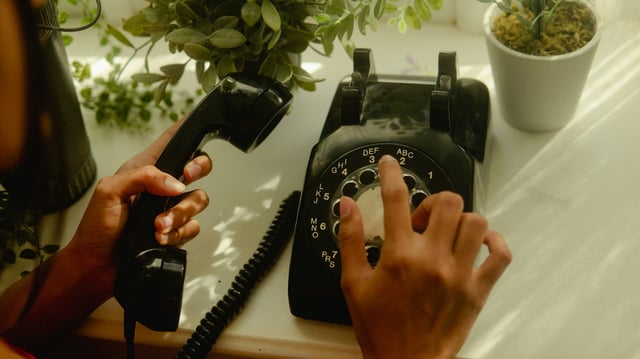 A rotary phone is pictured in this file photo. (Wesley Hilario/Unsplash)