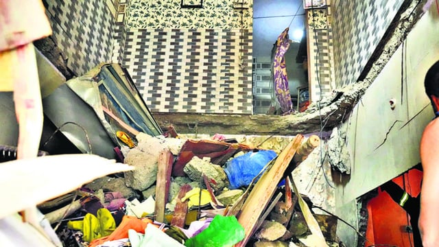 Kalyan, India -May 20 2025: Pic A slab from the second floor of the Ground -plus- 4 Saptashrungi building in Mangal ragho Nagar, Kalyan East, collapsed around 2:30 PM on Tuesday. The debris fell through to the ground floor. One senior citizen woman has been rescued so far. KDMC’s fire brigade and disaster management teams are on site, and rescue operations are ongoing. The building was constructed around 2002. Pic on Tuesday in India on 20 2025 - Story By Anamika Gharat ( Photo By Pramod Tambe).