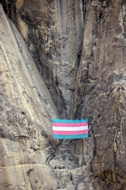 A  group of transgender, queer, and allied climbers unfurled a trans pride flag on El Capitan in Yosemite National Park, Calif., on Tuesday, May 20, 2025.  The flag is the largest flag ever flown on the famed granite monolith in the park, and hangs beneath Heart Ledges, a symbolic location near the literal and figurative heart of El Capitan. (Photo by Carlos Avila Gonzalez/San Francisco Chronicle via Getty Images)