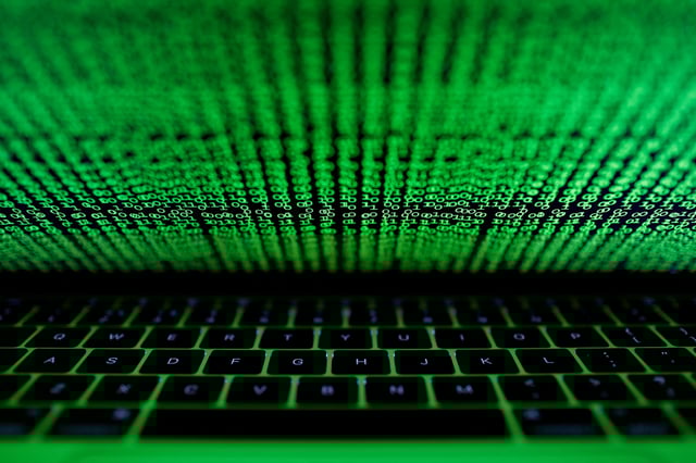 A computer keyboard lit by a displayed cyber code is seen in this illustration picture taken on March 1,  2017. REUTERS/Kacper Pempel/Illustration/File Photo