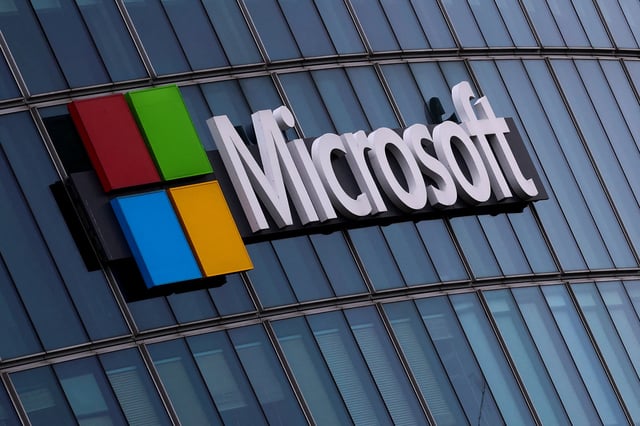 A view shows a Microsoft logo at Microsoft offices in Issy-les-Moulineaux near Paris, France, March 21, 2025. REUTERS/Gonzalo Fuentes/File Photo