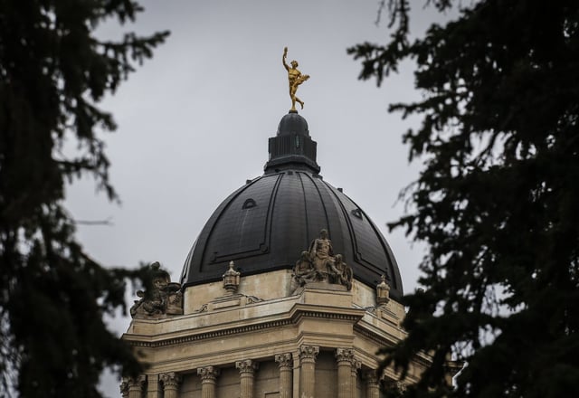The sculpture titled "The Golden Boy" is seen atop the exterior of the Manitoba Legislature in Winnipeg, Wednesday, Nov. 6, 2024. THE CANADIAN PRESS/John Woods