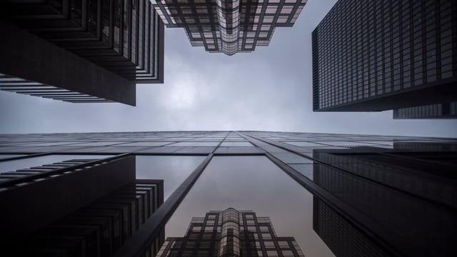 Bank buildings are photographed in Toronto's financial district on June 27, 2018. Canada Pension Plan Investments has dropped a net-zero by 2050 target for carbon emissions, according to an annual report released Wednesday, following several Canadian financial institutions that have backtracked on climate commitments.