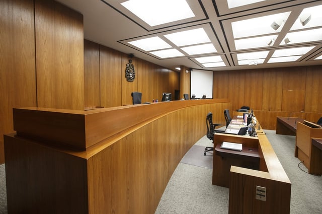 A courtroom is seen at the Edmonton Law Courts building in Edmonton on June 28, 2019. An arrest warrant has been issued for an Alberta woman who was allegedly released from jail last month with fake documents. THE CANADIAN PRESS/Jason Franson