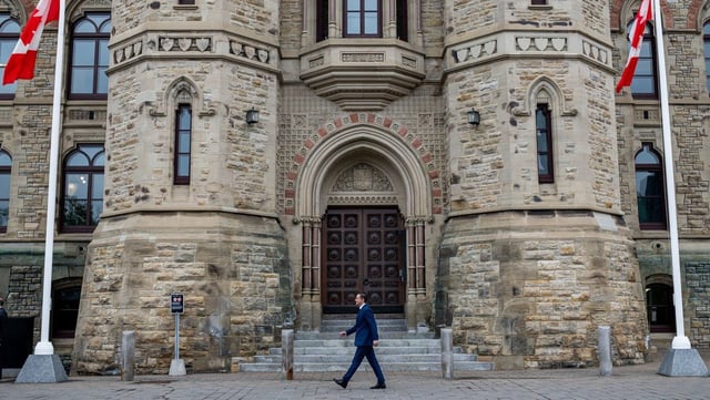 Conservative Leader Pierre Poilievre walks past the prime minister's entrance to West Block on Parliament Hill ahead of a press conference in Ottawa on Thursday, May 15, 2025. THE CANADIAN PRESS/Spencer Colby