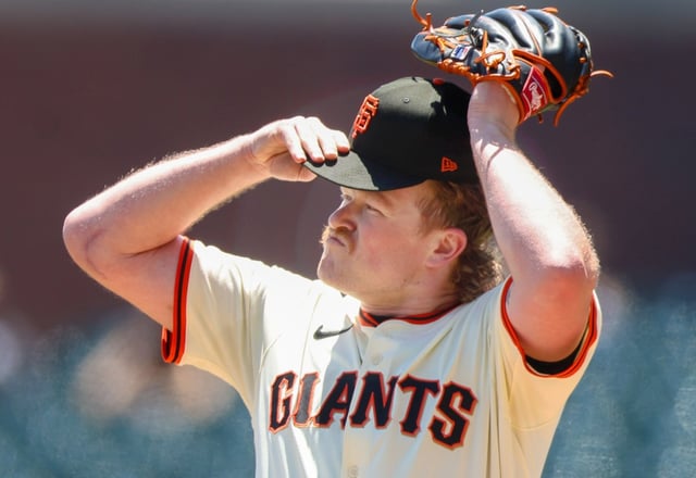 San Francisco Giants’ Logan Webb adjusts his hat after giving up three consecutive hits to the Kansas City Royals in the first inning on Wednesday, May 21, 2025, at Oracle Park in San Francisco, Calif. (Karl Mondon/Bay Area News Group)