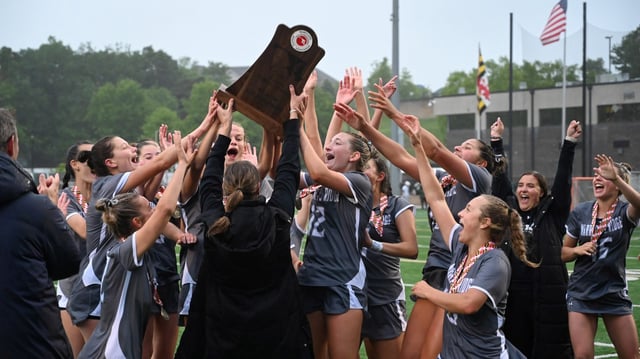 May 21, 2025: Marriotts Ridge players accept the championship trophy and celebrate their win over Severna Park during the Class 3A girls lacrosse state championship at Stevenson University on Wednesday. (Brian Krista/Staff)
