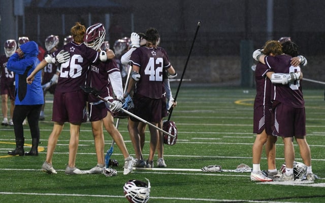 Towson players console each other after their loss during the Class 3A boys lacrosse state championship at Stevenson University on Wednesday. (Brian Krista/Staff)