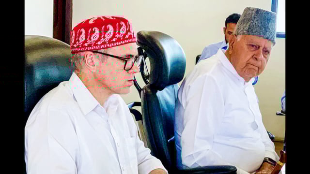 NC chief Farooq Abdullag and party vice-president and J&K chief minister Omar Abdullah during the party's central working committee meeting, at party headquarters in Srinagar on Wednesday. (ANI)