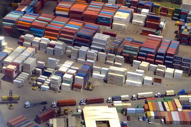 A forklift unloads shipping containers from trucks at a storage facility located near Sydney Airport in Australia, November 30, 2017. Picture taken November 30, 2017.  REUTERS/David Gray/File Photo