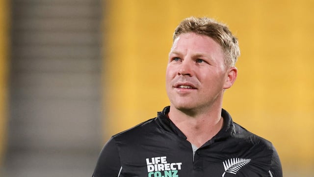 New Zealand's Tim Seifert walks from the field after a match.