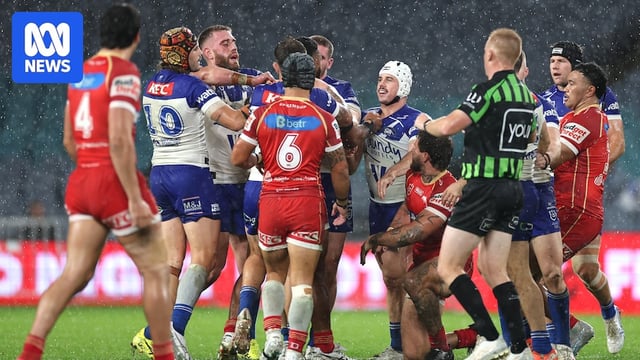 Two teams scuffle during a rugby league match