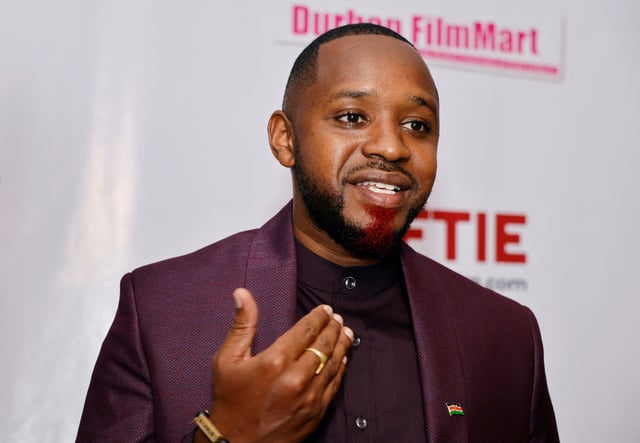 Kenyan social-political activist Boniface Mwangi speaks during a Reuters interview before the screening of the Kenyan documentary 'Softie' at the Prestige Cinema in Nairobi, Kenya October 16, 2020. Picture taken October 16, 2020. REUTERS/Thomas Mukoya/File Photo