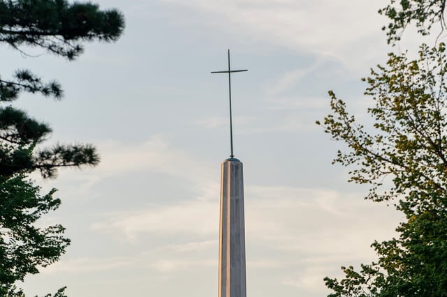 A cross sits atop the Archdiocese of Oklahoma City on Thursday, April 17, 2025 in Oklahoma City, Oklahoma. (AP Photo/Nick Oxford)