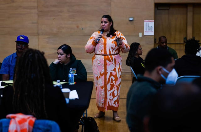Ashley Lee, an anti-racist impact facilitator, speaks during the community meeting in support of Rise East in January.