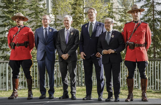 Canada&#39;s Finance Minister Francois-Philippe Champagne, second from right, United States secretary of the treasury Scott Bessent, third from right, Governor of the Bank of Canada Tiff Macklem, second from left, and United States Chair of the Federal Reserve Jerome Powel pose with RCMP officers prior to the G7 Finance Ministers meeting in Banff, Alberta, Wednesday, May 21, 2025.