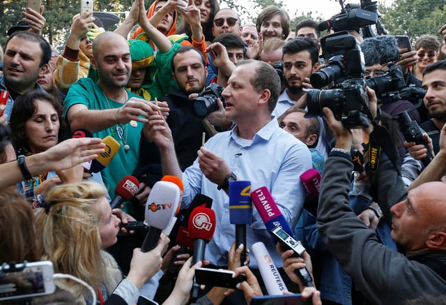Zurab Japaridze, leader of opposition Girchi party and presidential candidate for the upcoming election, gives joints to his supporters at the first "Cannabis Legalization Festival" in Tbilisi, Georgia October 20, 2018.  REUTERS/David Mdzinarishvili/File Photo