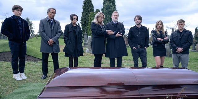The cast of Final Destination: Bloodlines gathered around a closed casket at a funeral. 