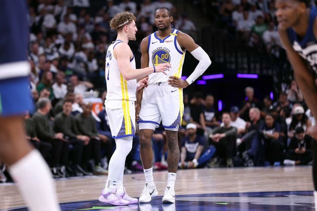 Golden State Warriors’ Jonathan Kuminga and Brandin Podziemski confer in 4th quarter of Minnesota Timberwolves’ 121-110 win in NBA Western Conference Semifinals’ Game 5 at Target Center in Minneapolis on Wednesday, May 14, 2025.