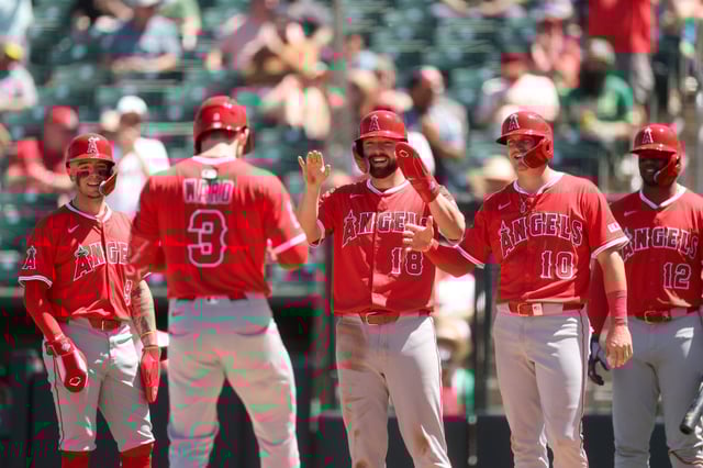 The Angels’ Taylor Ward (3) is greeted at home plate by, from left, teammates Zach Neto, Nolan Schanuel and Kevin Newman (10) after he hit a go-ahead grand slam in the seventh inning of their 10-5 victory over the Athletics on Thursday afternoon at Sutter Health Park in West Sacramento. (Photo by Ezra Shaw/Getty Images)