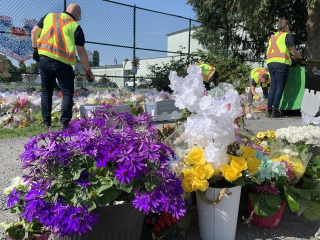 City of Vancouver workers begin to re-locate the memorial for Lapu Lapu Day festival victims at Fraser Street and 41st Avenue on May 22, 2025. 