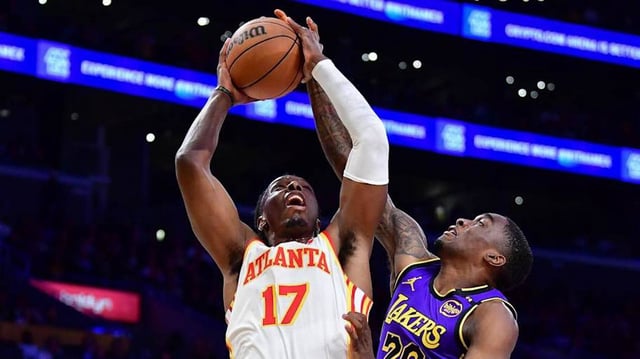 Atlanta Hawks center Onyeka Okongwu moves to the basket against Los Angeles Lakers guard Shake Milton.