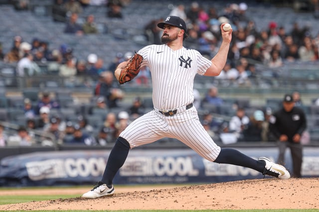 May 22, 2025; Bronx, New York, USA; New York Yankees starting pitcher Carlos Rodon (55) delivers a pitch during the third inning against the Texas Rangers at Yankee Stadium. Mandatory Credit: Vincent Carchietta-Imagn Images