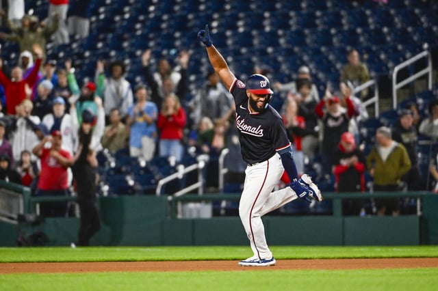 May 22, 2025; Washington, District of Columbia, USA; Washington Nationals third base Amed Rosario (13) reacts after hitting a walk-off RBI against the Atlanta Braves during the tenth inning at Nationals Park. Mandatory Credit: Brad Mills-Imagn Images