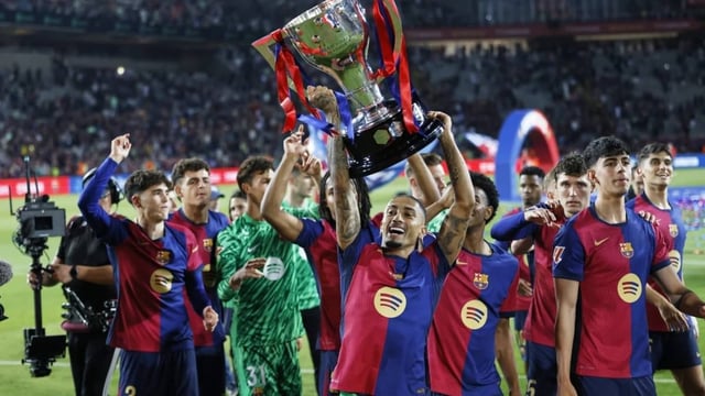 Raphinha celebrates with the La Liga title. | Image: AP