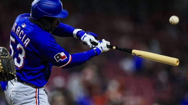 Apr 1, 2025; Cincinnati, Ohio, USA; Texas Rangers outfielder Adolis Garcia (53) bats against the Cincinnati Reds in the eighth inning at Great American Ball Park. Mandatory Credit: Katie Stratman-Imagn Images