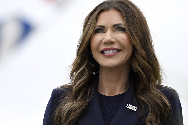 Homeland Security Secretary Kristi Noem smiles at the commencement for the United States Coast Guard Academy, Wednesday, May 21, 2025 in New London, Conn.