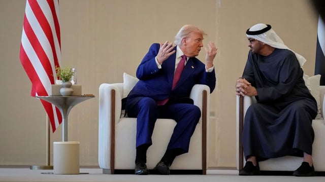 U.S. President Donald Trump and UAE President Sheikh Mohammed bin Zayed Al Nahyan speak during a welcome ceremony at Abu Dhabi International Airport, May 15, 2025 (AP photo by Altaf Qadri).