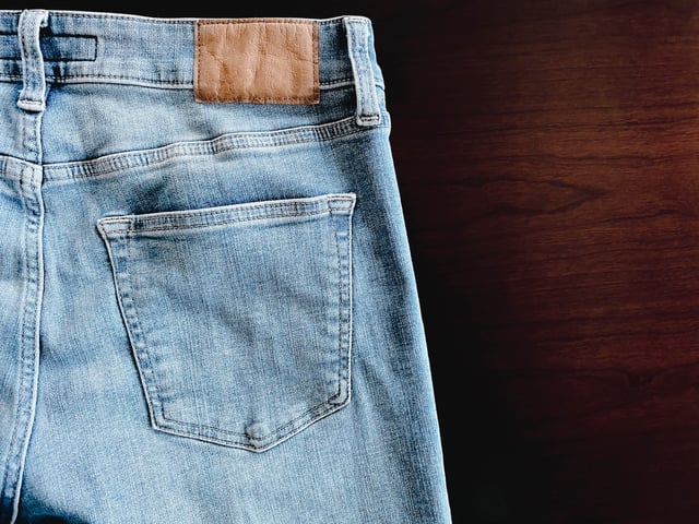 Close-up of back pocket on blue jeans