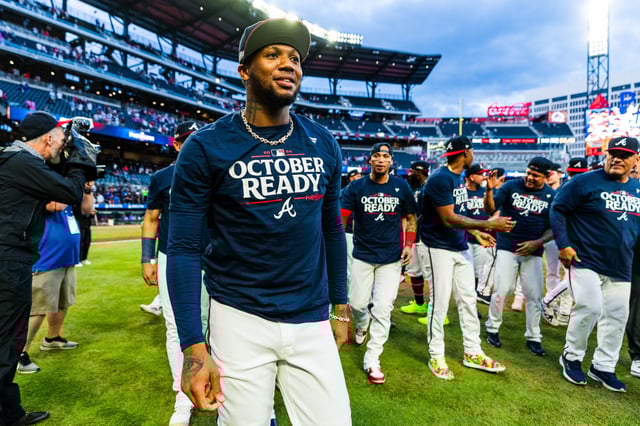ATLANTA, GA - SEPTEMBER 30: Ronald Acuña Jr. #13 of Atlanta Braves celebrates advancing to the National League Wild Card Series after defeating the New York Mets during game two of a double header at Truist Park on September 30, 2024 in Atlanta, Georgia.