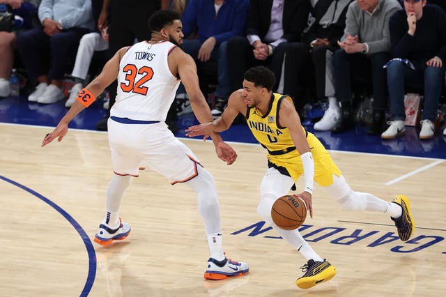 NEW YORK, NEW YORK - MAY 21: Tyrese Haliburton #0 of the Indiana Pacers is defended by Karl-Anthony Towns #32 of the New York Knicks during the third quarter in Game One of the Eastern Conference Finals of the 2025 NBA Playoffs at Madison Square Garden on May 21, 2025 in New York City.